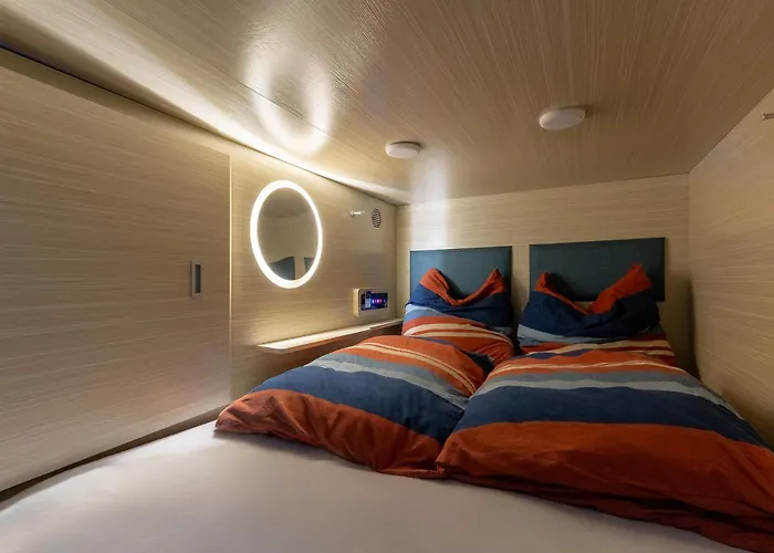 Günstiges Hotel: Mue Cubes - Capsule Hotel